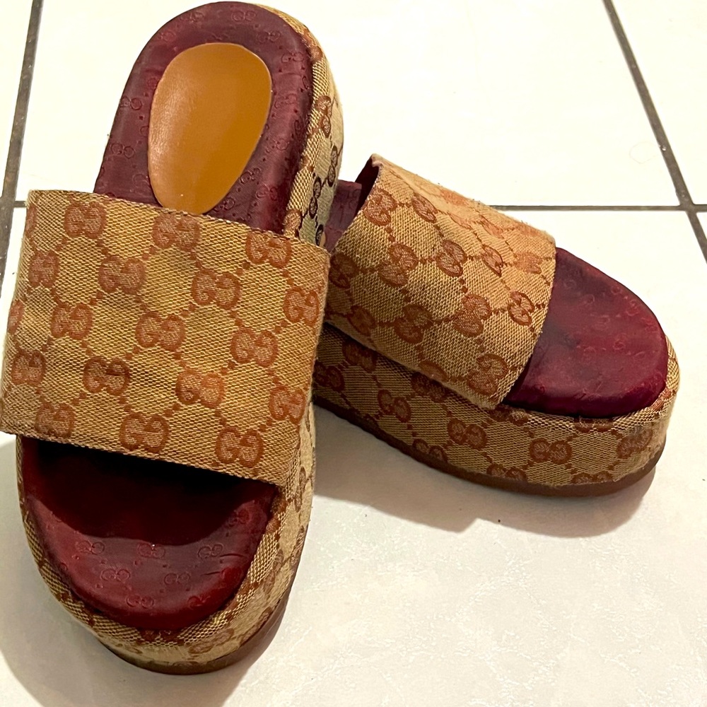 Gucci “GG” canvas flatform slides